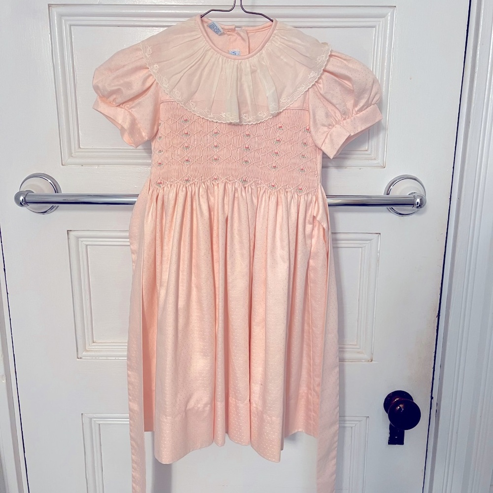 Beautiful hand smocked size 4 girl’s dress in pink. Vive La Fete by Karla Lacayo